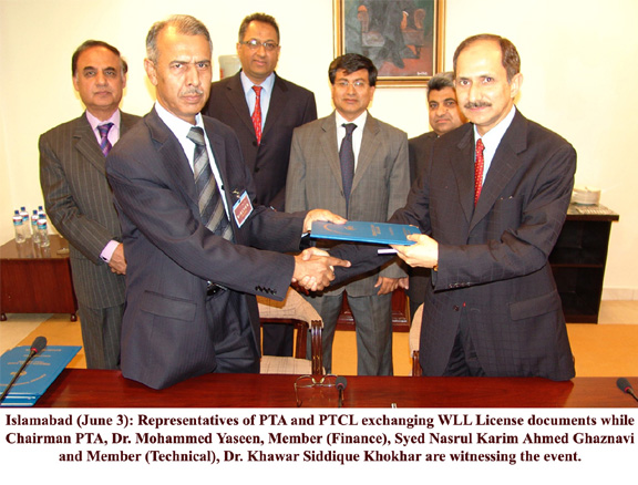 representative of pta and ptcl exchanging WLL licences document  