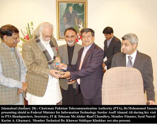 chairman pta presenting shield to minister of IT