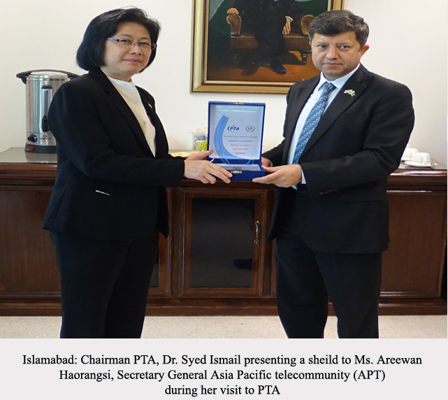 Chairman PTA Dr. Ismail Shah presenting a shield to Ms. Areewan Haorangsi